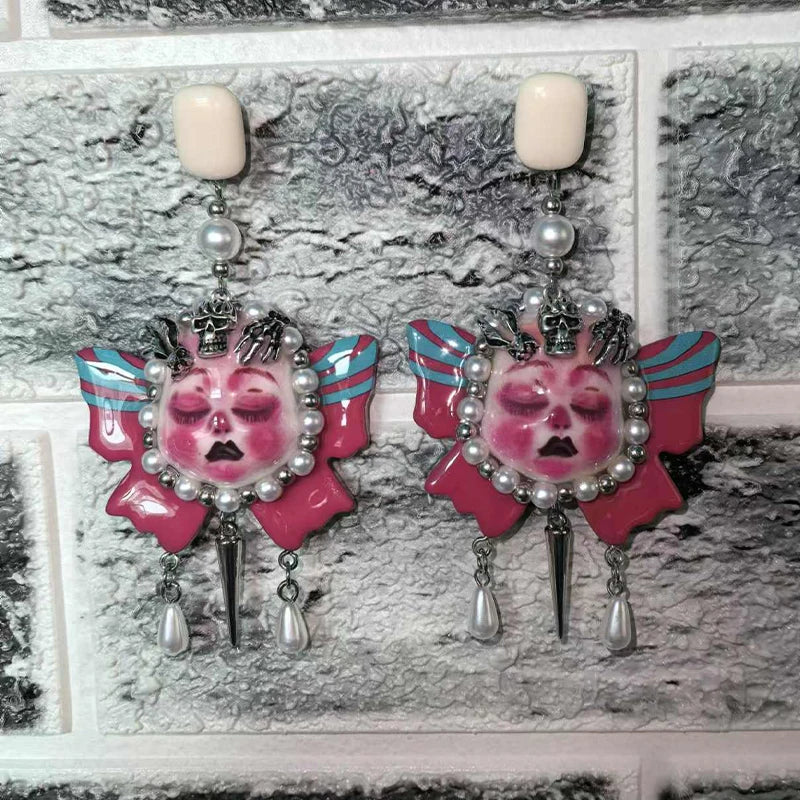 Brinco rostos de bonecas